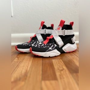 Nike Huarache City black white and neon coral.